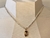 COLAR RIVIERA PRATEADO COM PINGENTE DOURADO LETRA N na internet