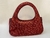 BOLSA DE MÃO CRAVEJADA COM CRISTAIS VERMELHOS