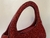 BOLSA DE MÃO CRAVEJADA COM CRISTAIS VERMELHOS na internet