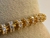 PULSEIRA RIVIERA DOURADA COM CRISTAIS na internet