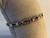 PULSEIRA EM OURO E RÓDIO COM CORAÇÕES E DETALHES DE CRISTAIS - comprar online