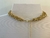 COLAR DOURADO COM PINGENTE DE CRISTAL ROSA E DETALHES EM PEDRAS na internet