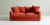 Sillón de dos cuerpos Thomas en color naranja con almohadones decorativos.