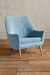 Sillón de un cuerpo RIvona en color celeste con respaldar decorado con botnes y patas de madera