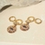 Brinco ear bling + medalha olho zircônias coloridas - banho de ouro rosé - comprar online