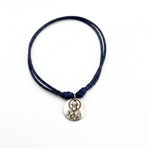 Pulsera con dijes religiosos
