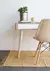 Silla Eames tapizada.