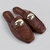 Nisse - Mocassin mule terroso com aplicação frontal
