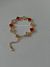 Pulseira trevo lisa & pedra vermelha dourada na internet