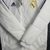 Real Madrid Bobojaco Branco com Detalhes Azuis - Camisas de Futebol | Puskás Sports