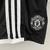 Kit Infantil Manchester United Preta 23/24 na internet