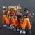 Conjunto de 4 figuras de ação Dragon Ball Son Goku Super Saiyan, detalhadas e coloridas, ideal para colecionadores, decoração e fãs do anime.