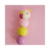 Marca texto fofo em forma de unicórnio, com cores pastel, contra um fundo rosa.