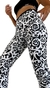 Legging con diseño de arabescos en blanco y negro, calce perfecto.