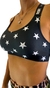 Top deportivo negro con estampado de estrellas blancas, modelo TOP AKITA ESTRELLAS NEGRAS.