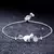 Pulseira Feminina com Zircônia Cúbica e Cristal Bola de Gato - comprar online