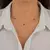 Choker 5 Olhos Gregos Azul de Prata mista na internet