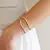 Bracelete Tubo Liso Ondulado cor: ouro 18k
