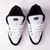 Tênis Drop Dead Ninety nas cores branco e preto, com detalhes em malha e sola branca