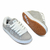 Tênis Qix Combat Suede na cor cinza e branco, com detalhes em suede e solado de borracha. Ideal para uso diário e atividades esportivas.