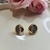 Brinco dois banhos ródio e dourado