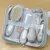 kit de cuidados com o bebê,  
kit higiene recém-nascido,  
kit bebê com escova e cortador de unhas,  
aspirador nasal infantil,  
acessórios de higiene para bebê,  
kit com bolsa organizadora para bebê,  
kit de cuidados livre de BPA,  
kit para higiene d