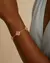 Pulseira Dourada Trevos Zircônia Rosa na internet