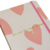 "Caderno Brochura Coração Capa Dura A5, com design delicado e capa dura resistente, perfeito para anotações e estudos.