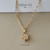 Pingente flor zirconia - ouro 18k