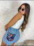Shorts jeans com flores no bolso - loja online