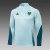 Conjunto de agasalho masculino da Adidas, na cor verde claro, composto por uma blusa de manga longa e calças, com detalhes do time Cruzeiro.