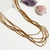 Imagem do colar longo feminino canutilho dourado claro