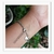 Imagem do Pulseira Feminina Prateada Pingentes