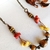 Você Pode Bijuterias Colar Longo Hippie Resina Feminino Vermelho Amarelo na internet