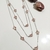Imagem do Colar Longo Cristais rosa feminino