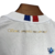 Camisa feminina do Esporte Clube Bahia, modelo 25/26, em branco com detalhes em vermelho e azul.