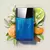 Frasco de colônia Quasar Classic 100ml com flores e frutas ao redor.