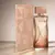 Frasco de perfume Natura Essencial Feminino 100ml com embalagem elegante em tons de rosa e dourado.