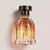 Frasco de perfume Colonia Floratta Variedades 75ml com tampa preta e design elegante.