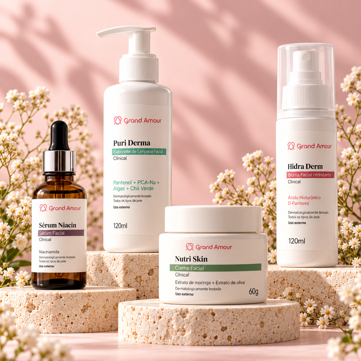 Sérum Niacin, Puri Derma, Hidra Derm e Nutri Skin da Grand Amour em cenário rosa