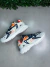 tenis lacoste L003 neo branco laranja