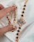 Relógio Trevo Rose com Pulseira Cravejado de Cristais na cor Preto. - comprar online