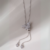 Colar gravata borboleta micro zircônia banhado em ródio branco.