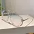 Óculos de sol máscara em acetato e metal, com frete grátis. Óculos de sol feminino escuro com estilo oversize, combinando design marcante em acetato e metal para um visual único e sofisticado.