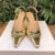 SLINGBACK COURO OURO SALTO MEDIO CECCONELLO na internet