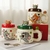 TAZA DE CERAMICA CON TAPA TOM Y JERRY 560ML