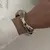 Joia de pulso em tom dourado vintage