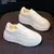 Imagem do Sapatos pequenos de couro branco com sola grossa