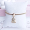 REF 394 - Pulseira folheada a ouro com pingente ursinho cravejado zircônia