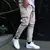 Calça casual masculina cordão na internet
